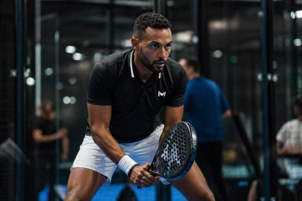 Padel player focused during a match at M Padel